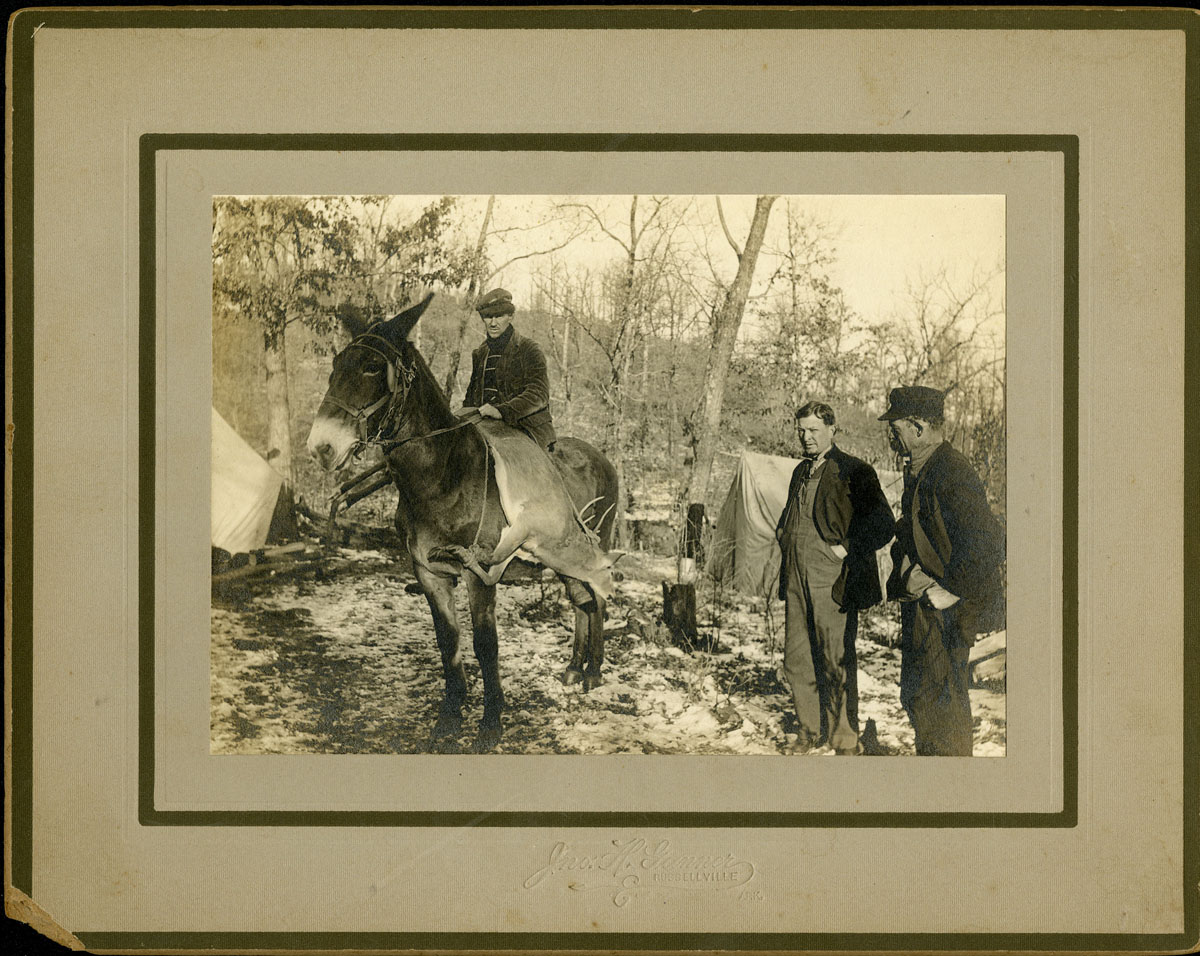 Three man at camp with deer, near Russellville, undated Three man at camp with deer, near Russellville, undated