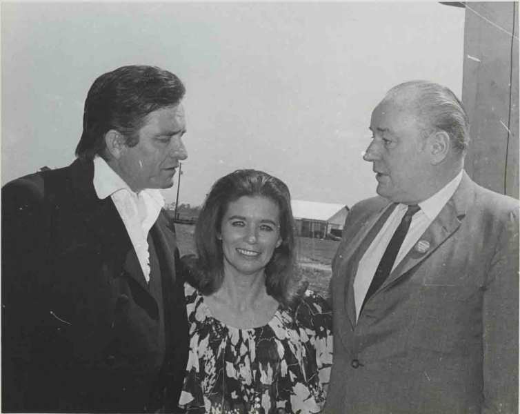 Cash, wife June Carter, and Governor Winthrop Rockefeller at Cummins prison farm, April 10, 1969.