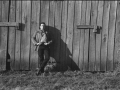 Cash leans against a barn in Dyess, fall 1968