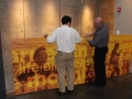 Two men assisting with the Johnny Cash exhibit