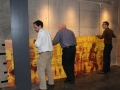 Three men assisting with the Johnny Cash exhibit