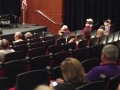 Unidentified individuals in a theater, blurred image
