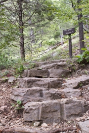 Stairs bearing rock drill marks with sign to CCC Quarry.