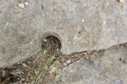 Rock drill hole in stair step from above.