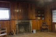 Fireplace and furniture built by CCC inside cabin.