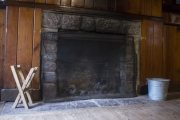 Fireplace inside cabin.