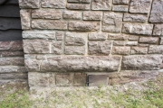 Exterior of chimney base on cabin.
