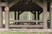 Support beams and picnic tables inside CCC Pavilion.