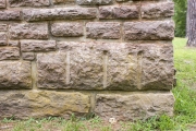 Close up of rock drill marks on stone used to build CCC Pavilion.