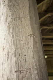 Marks of hand tools and carvings on support pillars at CCC Pavilion.