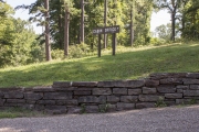 Rock retaining wall leading to cabin office.