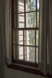 View of wooden siding from inside cabin.