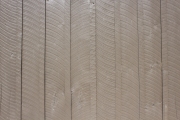 Close up of saw marks on boards covering cabin.