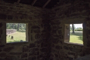 View from windows inside stone pavilion at Big Flat City Park.