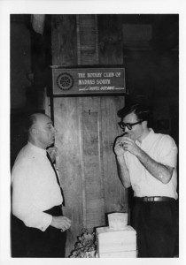 John Carland bites into a Minute Man hamburger at the University of Madras, India, April 1965