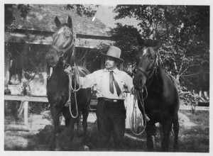 T. E. Garner with horses, ca. 1918