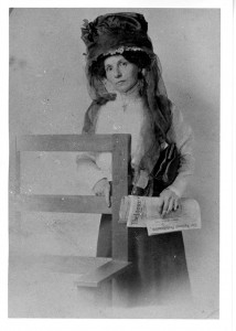 Babcock posing with temperance newspapers, undated