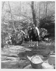 Babcock with Raymond Higgins wading in creek in Hemmed-in-Hollow, 1937