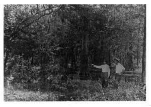 Black and White Image, Scott Bond and son in marshy area.