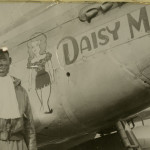 This is a photographic image of Woody Crockett standing next to the airplane "Daisy Mae."