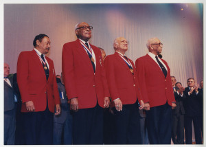 Photographic image of Woody Crockett (second from left) with Tuskegee airmen at Pentagon Pops Musical Salute to America's 'Guardians of Freedom,' February 15, 1999. courtesy UA Little Rock CAHC.