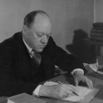 John Gould Fletcher in later years, seated at desk, undated