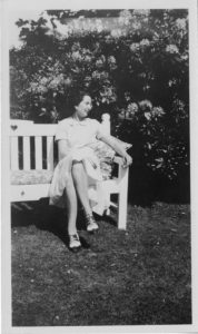 Presumably Florence “Daisy” Emily Goold Arbuthnot seated on bench, circa 1920s