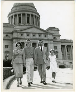 Lula "Puggie" Howell, Max Howell, Jr., Max Howell, and Patricia Howell in front of Arkansas State Capitol in Little Rock.