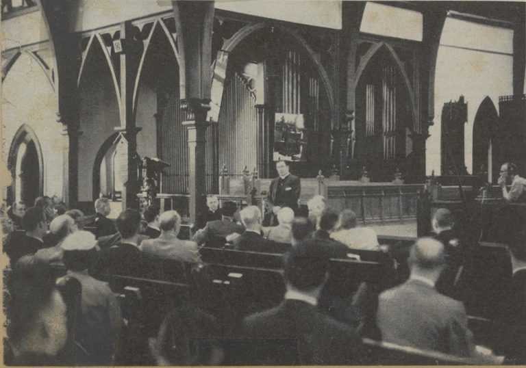 In this photo from the October 14, 1957 issue of Life Magazine, clergymen of three faiths listen to Bishop Brown.