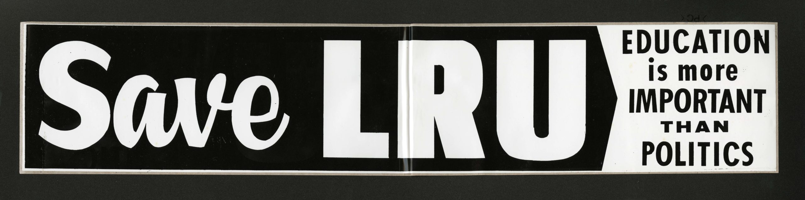 A bumper sticker reading "Save LRU"