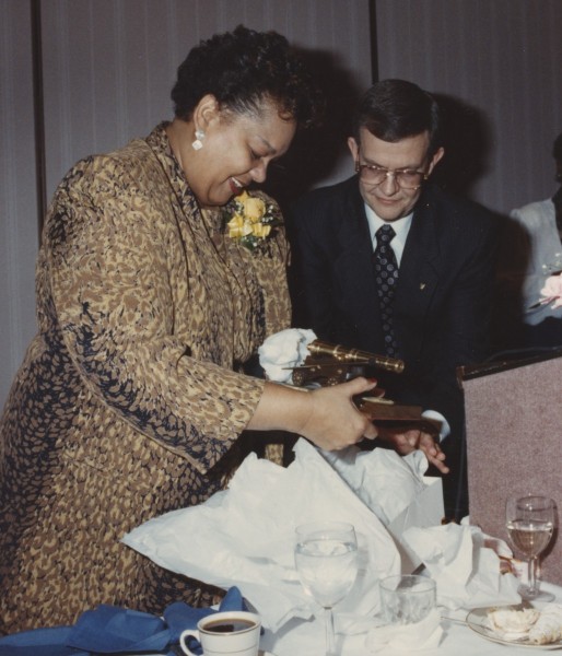 Montague receives a cannon replica at her retirement party, 31 January 1990