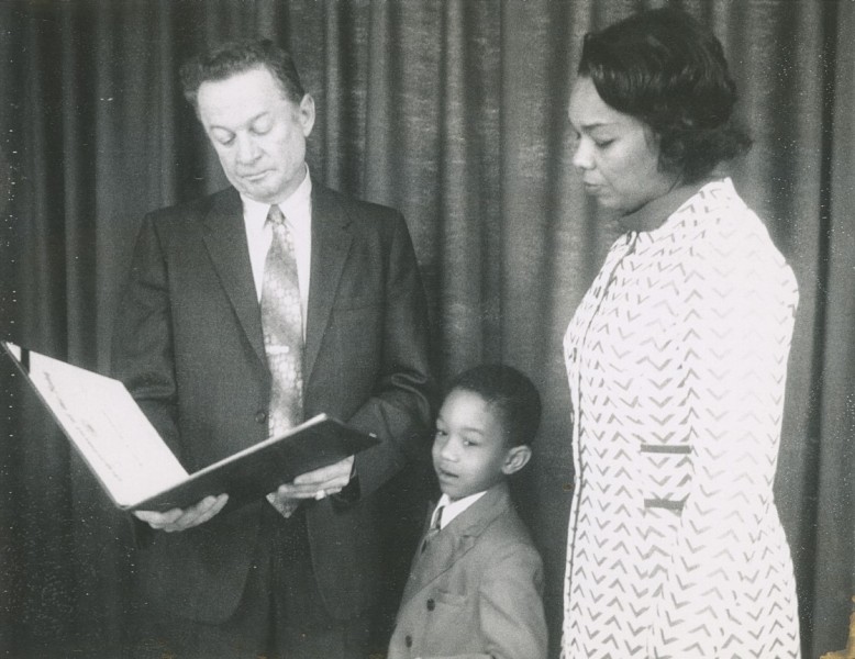 Montague receives the Navy Meritorious Civilian Service Award with her son David, 13 November 1972