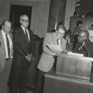 Dr. Townsend presents a citation recognizing the 40th anniversary of Arkansas Enterprises for the Blind, March 1987