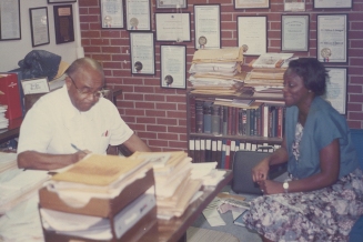 Dr. Townsend talks with a patient at his clinic on Wright Ave, September 1986