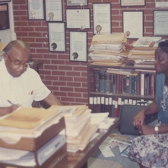 Dr. Townsend talks with a patient at his clinic on Wright Ave, September 1986