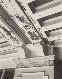 Peeling paint in Lafayette Hotel lobby showing the original stenciling underneath, undated