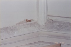 Damaged wall of the cathedral revealing paint or stenciling beneath, July 2004
