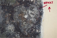 Removed plaster showing the faint remains of a painted heart on the wall, July 2004