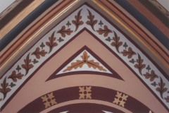 A close up of the restencilled area of a pointed arch, ca. 2007