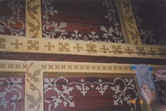 An artist tracing the stenciling pattern on wooden ceiling so it can be recreated, October 2007