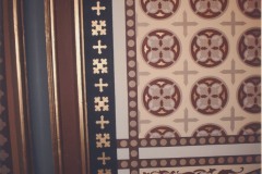 Newly stenciled portion of the wall above some stained glass, October 2007