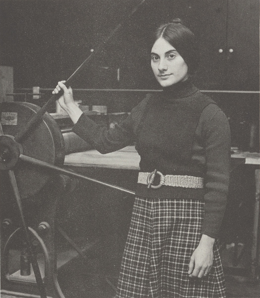 Becky Witsell posing with a large rolling press