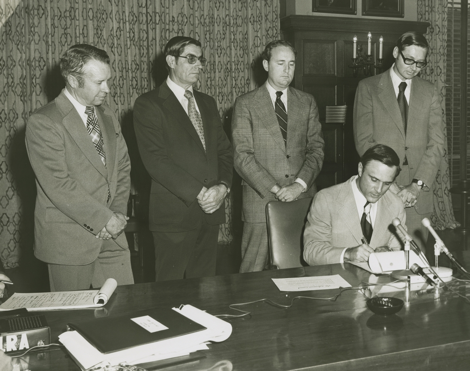 Photograph of Charles Moore, Lacy Landers, Joe Ford, Cal Ledbetter, and Governor David Pryor, at the signing of the bill calling for a constitutional convention, ca. 1975