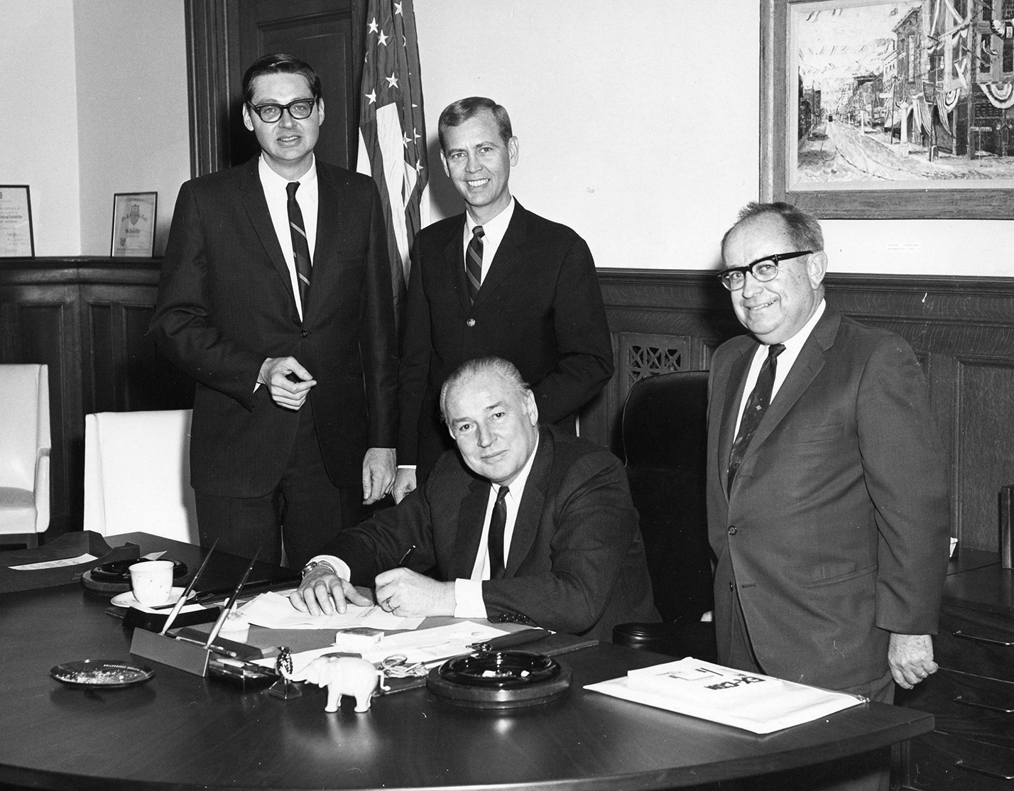 Cal Ledbetter, with Ben Allen, Oscar Alagood, standing next to Governor Winthrop Rockefeller, seated, in governor's office. ca. 1968