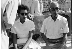 Elizabeth Eckford waiting for bus accompanied by L.C. Bates