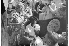 Elizabeth Eckford protected from hecklers by Grace Lorch while waiting for bus