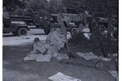 Arkansas National Guardsmen relaxing in shade on Central High School grounds