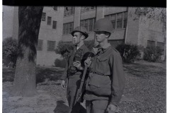 Two soldiers on patrol; 101st Airborne soldier with radio handset and the other possibly Arkansas Arkansas National Guard