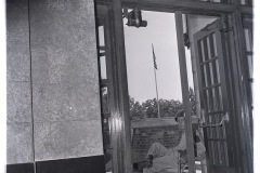 Arkansas National Guardsmen seated outside of entry to Central High School