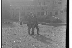 Two 101st Airborne soldiers walking across the lawn of Central High School